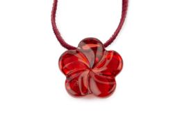 A Lalique 'Oxygene' red glass flowerhead pendant, on velvet cord, boxed