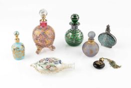 A silver overlaid green glass scent bottle and stopper, 8.5cm high, another silver overlaid