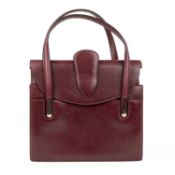A Asprey London burgundy leather, small vintage handbag with two internal sections and two