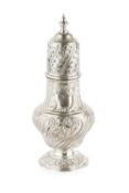 A late Victorian silver large sugar castor, of baluster form, repousse decorated with stylised