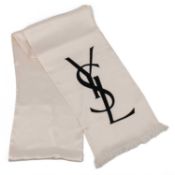 An Yves Saint Laurent scarf Featuring YVS logo in black and fringed at each end. 100% silk Long.