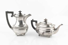 A George V silver teapot, with gadrooned border, and ebonised handle and knop, maker's mark worn,