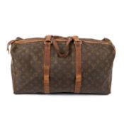 A Louis Vuitton Paris vintage travel bag in monogram canvas Two padlocks - numbers 154 and 157 (