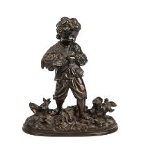 A 19th century bronze, boy with a birds nest , numbered 23382 19cm wide 23.5cm high Good some