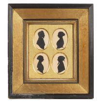 An early Victorian family group of four silhouettes all mounted in a gilded frame overall 39cm x