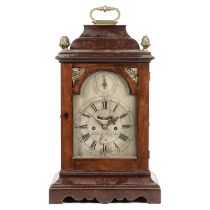 An 18th century bracket or table clock, the break arch silvered Roman dial with Arabic five minutes,