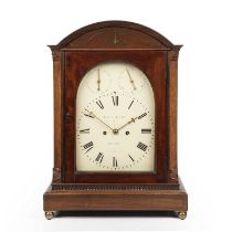 A 19th century mahogany table clock, the white painted arched Roman dial signed James McCabe,