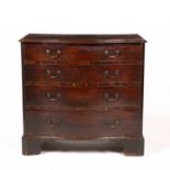 A George III mahogany serpentine chest of four long graduated drawers with brass swan neck handles