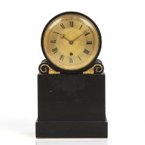 A 19th century polished slate drum head mantel timepiece with gilded engine turned Roman dial,