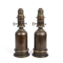 A pair of patinated bronze Victorian oil lamps by Miller & Sons Piccadilly 38cm high