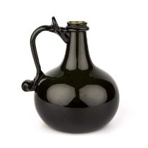 A green glass onion serving bottle, 15cm wide 18cm high This bottle is thought to be a reproduction.