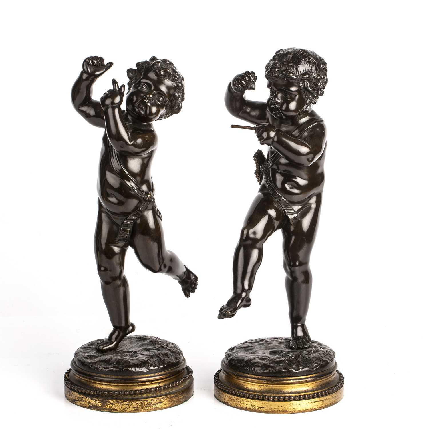 After Claude Michel Clodion (1738-1814) A pair of dancing musical cherubs, bronze.14cm wide 35cm