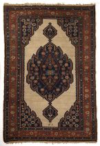 An antique Persian Serab rug with a banded boarder and floral geometric decoration. 132cm x 204cm