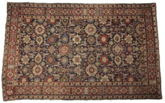 An Antique Persian Kuba rug with foliate decoration 160cm x 246cm wear and small repairs