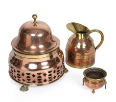 A 19th century copper foot warmer with paw feet 45cm wide 54cm high together with a copper jug and