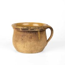 A antique post medieval jug with straw glaze, possibly Verwood circa 16th/17th Century 17.5cm wide