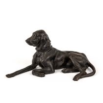 A 1960s Eastern European cast iron model of a dog with a makers mark to the base, 34cm wide x 18cm