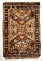 Two early 20th century middle eastern rugs decorated with birds and animals one signed. the