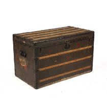 An early 20th century E Goyard Aine Travelling Trunk with chevron decoration, wooden slats and