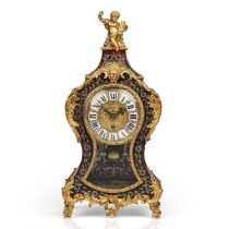 A Louis XVI style pewter and tortoiseshell boulle mantel timepiece, the gilt brass cast dial with