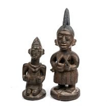 Two early 19th century African Nigerian tribal carved wood figures 16cm wide 46cm high.