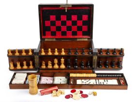 A late Victorian walnut cased games compendium by the Royal Cabinet of Games the fitted interior