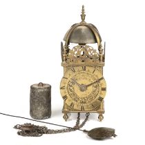 Nicholas Coxeter. A 17th century brass lantern clock, the Roman chapter ring with stylised fleur-