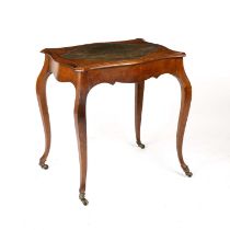 A mid 19th century walnut writing table/centre table with a leather inset shaped top and cabriole