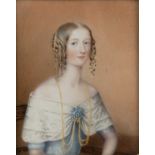 A late 18th or early 19th century miniature portrait of a lady in a blue dress, painted on ivory 9.