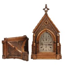 A Victorian Carved oak Gothic revival bracket clock by Wassell and Halford London 1875. The