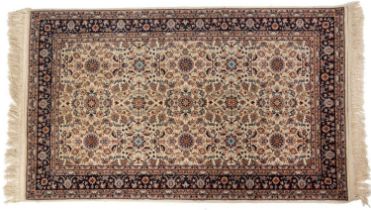 A 20th century Middle Eastern cream ground rug with floral decoration 96cm x 163cm