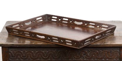 George III mahogany Chippendale-style tray with pierced decoration and handles, with a burgundy felt