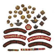 Militaria interest collection of tunic buttons, medal bars, cap badges, embroidered regiment