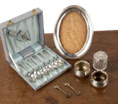 Collection of miscellaneous silver comprising: a silver photo frame, silver spoons, silver topped