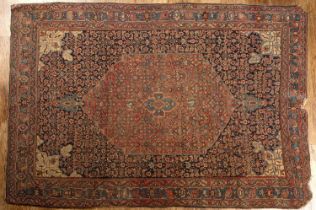 Blue ground rug Persian, with a red ground foliate central panel, 210cm x 140cm Worn and with