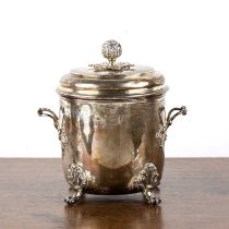 George V silver biscuit barrel with lid and twin handles, standing on four scroll pad feet,