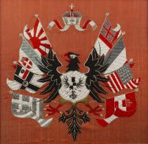Two embroidered war memorials the first vermillion ground, with a black eagle to the centre, the