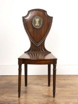 Mahogany hall chair 19th Century, with shield waisted back, with inset castle and crescent moon