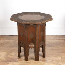 Octagonal carved table Indian, the top with an octagonal border, the border intricately carved