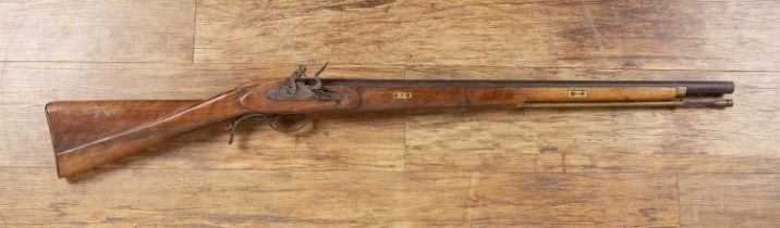 Flintlock rifle with a walnut stock, engraved plate and BP proof mark,113cm in length With signs