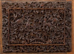 Framed Burmese carved panel with open-fretwork decoration, possibly once mounted on a box lid,