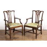Pair of mahogany elbow chairs 18th Century, in the style of George Hepplewhite with lattice backs,