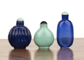 Three glass snuff bottles Chinese, 1850-1900 including a translucent dark blue glass round sided