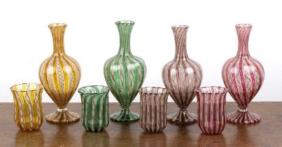 Set of four Venetian latticino glass water carafes with tumblers 19th Century, in green, brown,