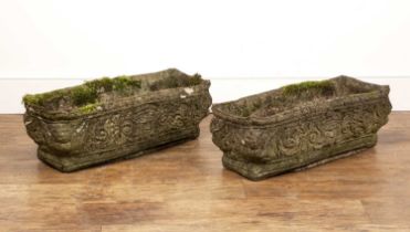 Pair of reconstituted troughs each with figurehead and scroll decoration, 65cm x 25cm Weather worn