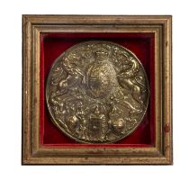 Milner safe plaque brass roundel in later frame, approx 12cm across, the overall frame 17.5cm x 17.