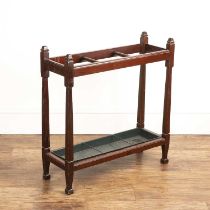 Mahogany stick stand with three sections and a blue metal lining, with carved details, approximately