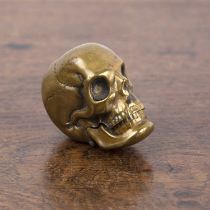 Novelty brass vesta case in the form of a skull, unmarked, 4.5cm across approx overall At present,