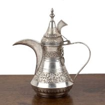 Silver metal coffee pot Omani, with embossed bands of foliate designs, 27cm high Some slight