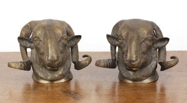 Pair of decorative bronze ram's heads 20th Century, with wall mount fittings to the reverse,